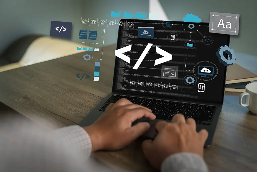 Close-up of a person typing on a laptop displaying code on the screen, surrounded by floating icons for programming, cloud services, databases, settings, and typography, representing software development, coding, and modern web or app development workflows.